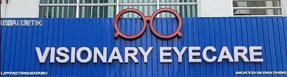 The Visionary Eyecare shop sign, with its red spectacles logo, above the shop at OUG Parklane