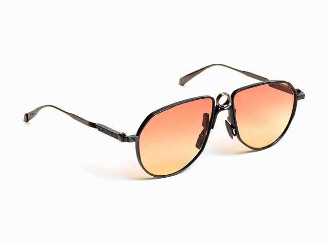 Gunmetal pilot sunglasses with orange-to-yellow gradient lenses